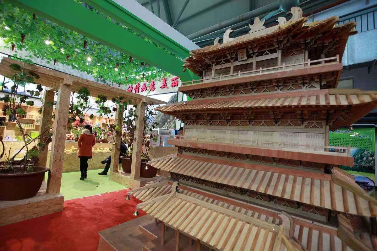 Large wooden Guanque Tower model assembled at an exhibition